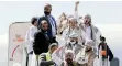  ?? | Reuters ?? FREED Houthi prisoners arrive at Sana’a airport, Yemen, yesterday.