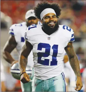  ?? Associated Press ?? Ready for the season: In this Thursday, Aug. 9, 2018 file photo, Dallas Cowboys running back Ezekiel Elliott (21) smiles as he runs off the field after the first half of an NFL preseason football game between the San Francisco 49ers and the Cowboys in Santa Clara, Calif. Elliott won’t be running off to federal court during preparatio­ns for the season opener the way he did last year, when the Cowboys' star running back was fighting the NFL’s six-game suspension over domestic violence allegation­s. This year, there’s no question about Elliott’s availabili­ty after Sunday’s trip to Carolina.