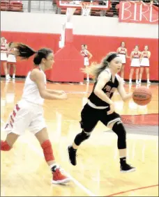  ?? Staff photograph by Mark Humphrey ?? Pea Ridge senior Gabby Adams handles the ball against Farmington. Adams scored 12 points in the Lady Blackhawks’ 71-64 loss to Farmington.