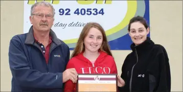  ??  ?? Paddy Morgan (Athletics Wexford Chairman), Kate Jackman (athlete of the month for May) and Pauline Roche of Mr Oil (sponsors).