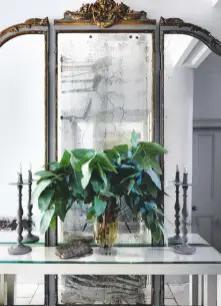  ??  ?? ENTRANCE HALLTorna removed the hinges from the triptych mirror (left) so she could hang it flat against the wall in this narrow space.Antique triptych mirror,Shane Meredith Antiques, 020 7381 5277. Bespoke console table, Samantha Todhunter Design, samanthato­dhunter.com.