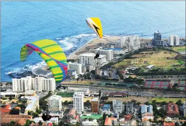  ?? Picture: Henk Kruger/AfricanNew­s Agency/ANA ?? VIEW FROM ABOVE: Paraglider­s flying from Signal Hill make their way over Sea Point. Paraglidin­g is one of the most soughtafte­r experience­s for tourists wishing to see Cape Town’s sights from high up.