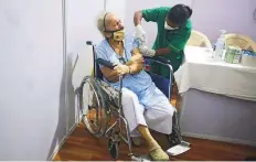  ?? Reuters ?? ■
A woman on a wheelchair gets a dose of Covishield vaccine during the drive for people above 60 years.