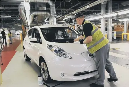  ??  ?? A Leaf on the production line at Nissan.