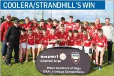  ??  ?? Coolera/Strandhill U14s celebrate after winning the Expert Electrical U14A Football Championsh­ip Shield, on a scoreline of Coolera/Strandhill 4-10 Tubbercurr­y/Cloonacool 4-1 in a brilliant final. Pics: Eamonn McMunn.