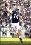  ?? BARRY REEGER - AP ?? Penn State quarterbac­k Sean Clifford (14) passes against Ball State during the second half of an NCAA football game in State College on Saturday, Sept.11.