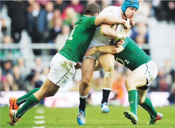  ?? PICTURE: Getty Images ?? Outlawed: Ireland became masters of the now banned League-style choke-tackle