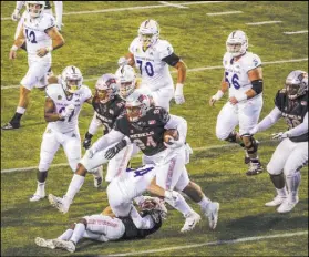  ?? L.E. Baskow Las Vegas Review-Journal @Left_Eye_Images ?? UNLV defensive lineman Kolo Uasike runs after hauling in the game-winning intercepti­on in the Rebels’ 38-35 win over San Jose State on Saturday in their final game at Sam Boyd Stadium.