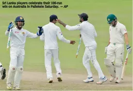  ?? — AP ?? Sri Lanka players celebrate their 106- run win on Australia in Pallekele Saturday.