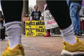  ?? Raquel Natalicchi­o/Staff photograph­er ?? People gather on Jan. 28 in downtown Houston to protest the killing of 29-year-old Tyre Nichols by Memphis police officers.