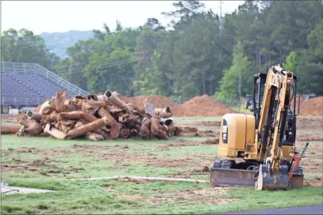  ?? Tommy Romanach / Rome News-Tribune ?? A bulldozer stands on Lynn Hunnicutt Field at Pepperell High School as the field is being refurbishe­d this summer because of a drainage problem.