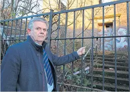  ??  ?? Lochee councillor Charlie Malone beside the building.