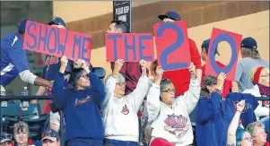  ?? AP PHOTO ?? Cleveland Indians fans cheer for their team to win their 20th straight game during the fourth inning in a game against the Detroit Tigers on Tuesday in Cleveland.