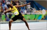  ?? AP PHOTO BY DAVID J. PHILLIP ?? In this 2016, file photo, Usain Bolt celebrates winning the gold medal in the men’s 200-meter final during the athletics competitio­ns of the 2016 Summer Olympics at the Olympic stadium in Rio de Janeiro, Brazil.