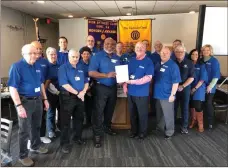  ?? K.T. Mckee ?? Rome Mayor Bill Collins (center left) presents the Rome Noon Optimist Club with a proclamati­on Monday declaring that Rome will join Optimist Internatio­nal in celebratin­g the first Thursday of every February as “Optimist Day.”