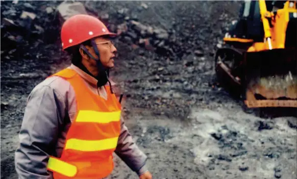  ??  ?? Guo inspects road conditions in a mining area. Before being elected a delegate to the 18th CPC National Congress in 2012, Guo arrived at his office two hours early every day to study before work. by Yang Qing/xinhua