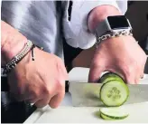  ??  ?? A CUT ABOVE Preparing food in the kitchen