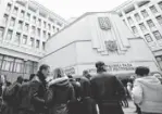  ?? DARKO VOJINOVIC, AP ?? Pro-Russian protesters gather in front of a government building in Simferopol, Crimea, on Feb. 25.