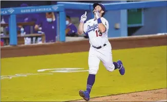  ?? Ashley Landis Associated Press ?? MAX MUNCY’S two-run blast in the third inning was one of four home runs for the Dodgers.