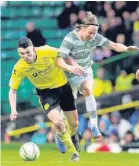  ??  ?? Determined John McGinn (left) holds off Stefan Johansen