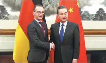  ?? FENG YONGBIN / CHINA DAILY ?? State Councilor and Foreign Minister Wang Yi meets with German Foreign Minister Heiko Maas in Beijing on Tuesday.