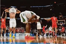  ?? Brett Coomer/staff photograph­er ?? Baylor guards Ja'kobe Walter, center, and Rayj Dennis endure some March sadness after a rally against Clemson falls short.