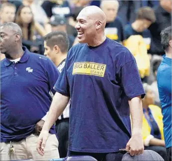  ?? Josh Lefkowitz Getty Images ?? LaVAR BALL WEARS the family brand as he watches a recent Chino Hills High game. “If you don’t have a following, it’s not going to work,” says Ball, who is taking advantage of UCLA’s tournament run.