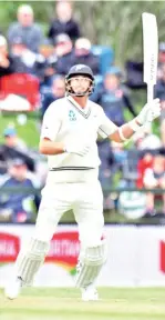  ?? — AFP photo ?? Counter-strike: Tim Southee during his 108-run seventh wicket stand with BJ Watling.