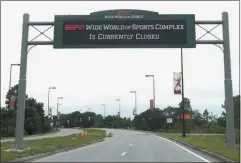  ?? JOHN RAOUX ?? A sign at the entrance to ESPN’S Wide World of Sports at Walt Disney World is seen Wednesday, June 3, 2020, in Kissimmee, Fla. The NBA has told the National Basketball Players Associatio­n that it will present a 22-team plan for restarting the season at Disney.