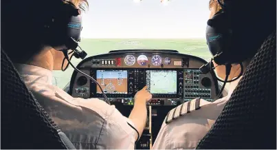  ?? Picture top: Steve Macdougall. ?? Top: ACS Aviation managing director Graeme Frater. Above: one of the firm’s flight simulators.