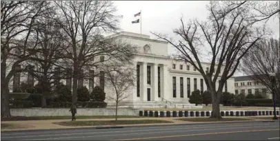  ??  ?? The US Federal Reserve building stands in Washington, DC. Fed officials have left little doubt that they intend to raise the benchmark lending rate range a quarter point later this month. The economy is strong and continues to generate jobs, and inflation is around their 2% target.