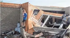  ?? CARA OWSLEY/USA TODAY NETWORK ?? Hayden Snider, 8, explores the debris of his grandparen­ts’ home in Celina, Ohio, after a tornado hit.