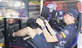  ?? (Photo L.M.) ?? En chaussette, tranquille dans son fauteuil, Max Verstappen a fait le tour du circuit de Monaco en ’’’.