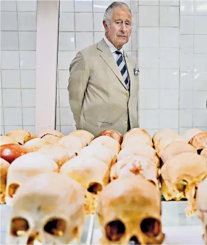  ?? ?? The Prince of Wales and Duchess of Cornwall visited the Kigali Genocide Memorial in the Rwandan capital, where they saw the skulls of hundreds of victims laid out and images of children killed in the 1994 slaughter. The Duchess remarked: ‘What humans can do to other humans’