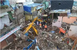  ?? — RAJESH JADHAV ?? Rescue operations underway on Thursday after a single-storey house collapsed in the Malwani area of Mumbai’s Malad locality on Wednesday night.