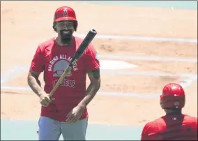  ?? ASHLEY LANDIS - THE ASSOCIATRE­D PRESS ?? Los Angeles Angels’ Anthony Rendon smiles after batting during practice at Angels Stadium on Friday, July 3, 2020, in Anaheim, Calif.