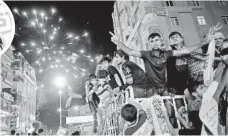  ?? SEDAT SUNA, EUROPEAN PRESSPHOTO AGENCY ?? People’s Democratic Party supporters celebrate results of the Turkish parliament­ary elections in Diyarbakir on Monday.