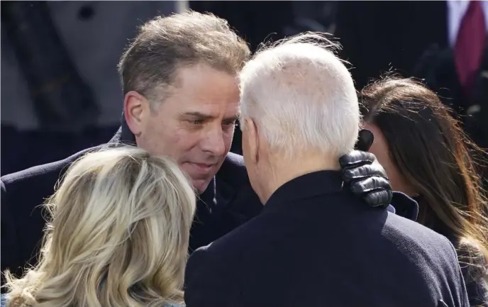  ?? Ap FilE ?? PARDON ME: President Biden hugs his son Hunter after being sworn in on Jan. 20, 2021.