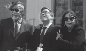  ?? RED HUBER/ORLANDO SENTINEL ?? Defense attorneys Fritz Scheller, left, Charles Swift and Linda Moreno for Noor Salman react to a question during a press conference Friday after the jury found Noor Salman not guilty on all charges at the Orlando Federal Courthouse.