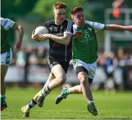  ??  ?? Sligo’s Liam Gaughan in action with David Carrabine of London.