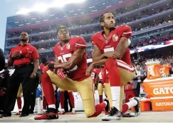  ?? Associated Press ?? ■ In this Sept. 12, 2016, file photo, San Francisco 49ers safety Eric Reid (35) and quarterbac­k Colin Kaepernick (7) kneel during the national anthem before an NFL football game against the Los Angeles Rams in Santa Clara, Calif.
