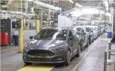  ?? — Reuters ?? Lineup of vehicles is seen at the Ford Assembly Plant in Wayne, Michigan.