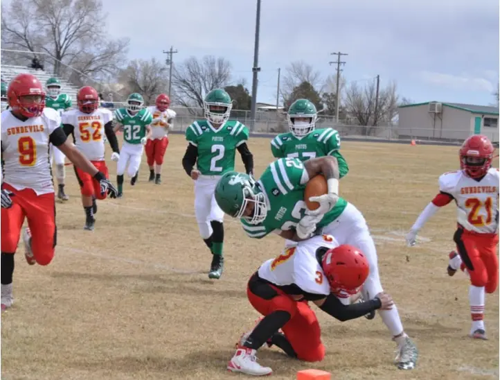  ?? Photo by Ger Demarest. ?? Moriarty's Caden Dunn fighting his way into the end zone for the first of his four touchdowns against Española Valley March 13.