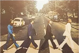  ??  ?? The iconic photo of The Beatles crossing Abbey Road