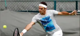  ?? Peter Klaunzer / Keystone via AP ?? Roger Federer practices Saturday at the All England Lawn Tennis Championsh­ips in Wimbledon, London. Federer is hoping to earn his eighth Wimbledon title.