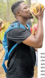  ?? ?? A trekker enjoys a coconut after the 10km hike at Forest Trek 2023 held in the Bull Head Forest Reserve, Clarendon, on March 25. The Forest Trek in Jamaica is hosted annually to help raise awareness about the importance of forests.