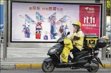  ?? NG HAN GUAN / ASSOCIATED PRESS ?? Chinese consumers are expected to spend tens of billions on everything from fresh food to luxury goods during this year’s Singles’ Day online shopping festival.