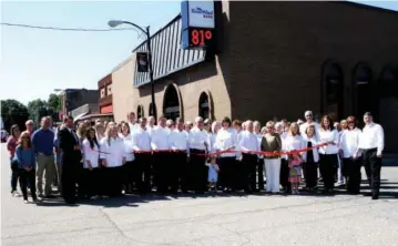  ?? SUBMITTED PHOTO ?? Directors and employees cut the ribbon at the main location in Augusta on Sept. 14, 2015, the day the bank changed its name from The Bank of Augusta to RiverWind Bank.