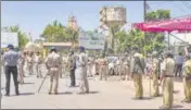  ?? PTI ?? Heavy police deployment after migrant workers clashed with police during a protest at Mora village in Surat, Saturday.