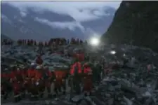  ?? JIANG HONGJING/XINHUA VIA AP ?? In this Saturday photo released by China’s Xinhua News Agency, rescuers work at the accident site after a landslide occurred in the mountain village of Xinmo, Maoxian county, in southweste­rn China’s Sichuan Province. Crews searching through the rubble...